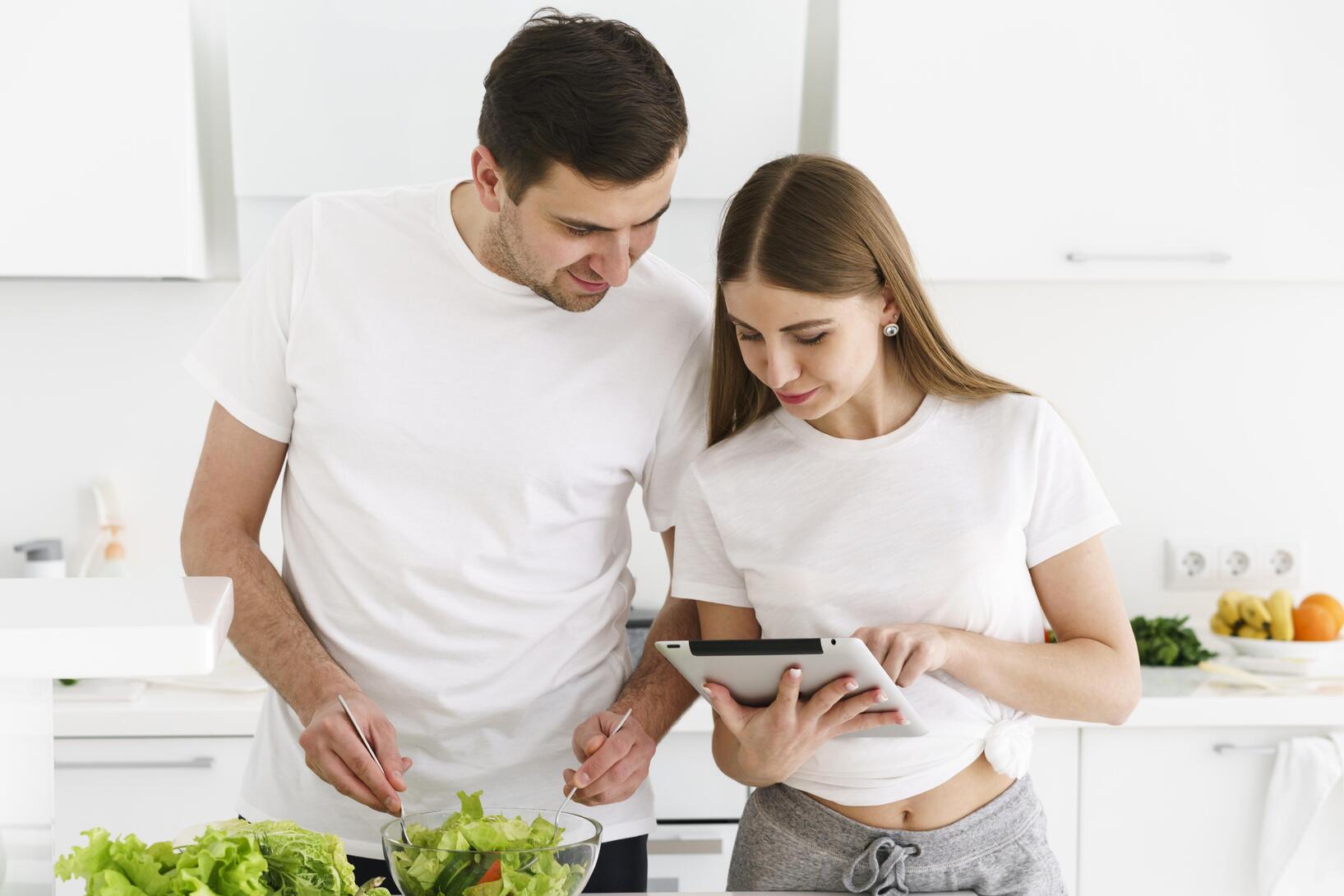 couple looking tablet at core concept