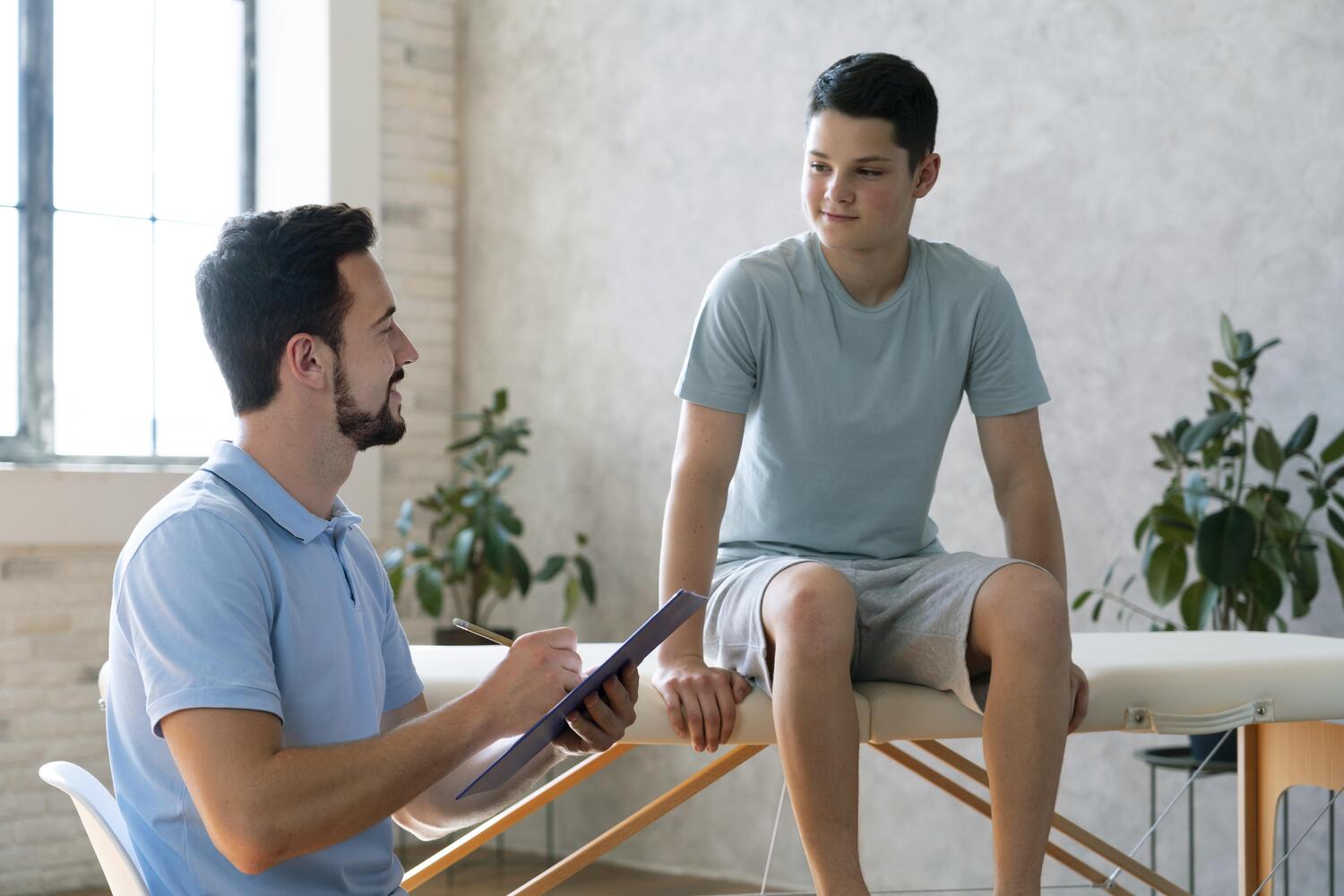 Doctor Helping Boy Physiotherapy Medium Shot at Core Concept