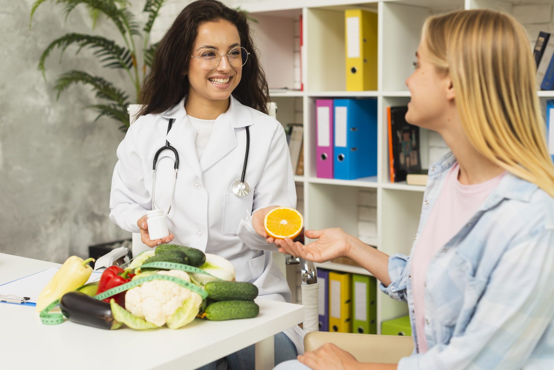 Medium Shot Women Talking About Fruits at Core Concept