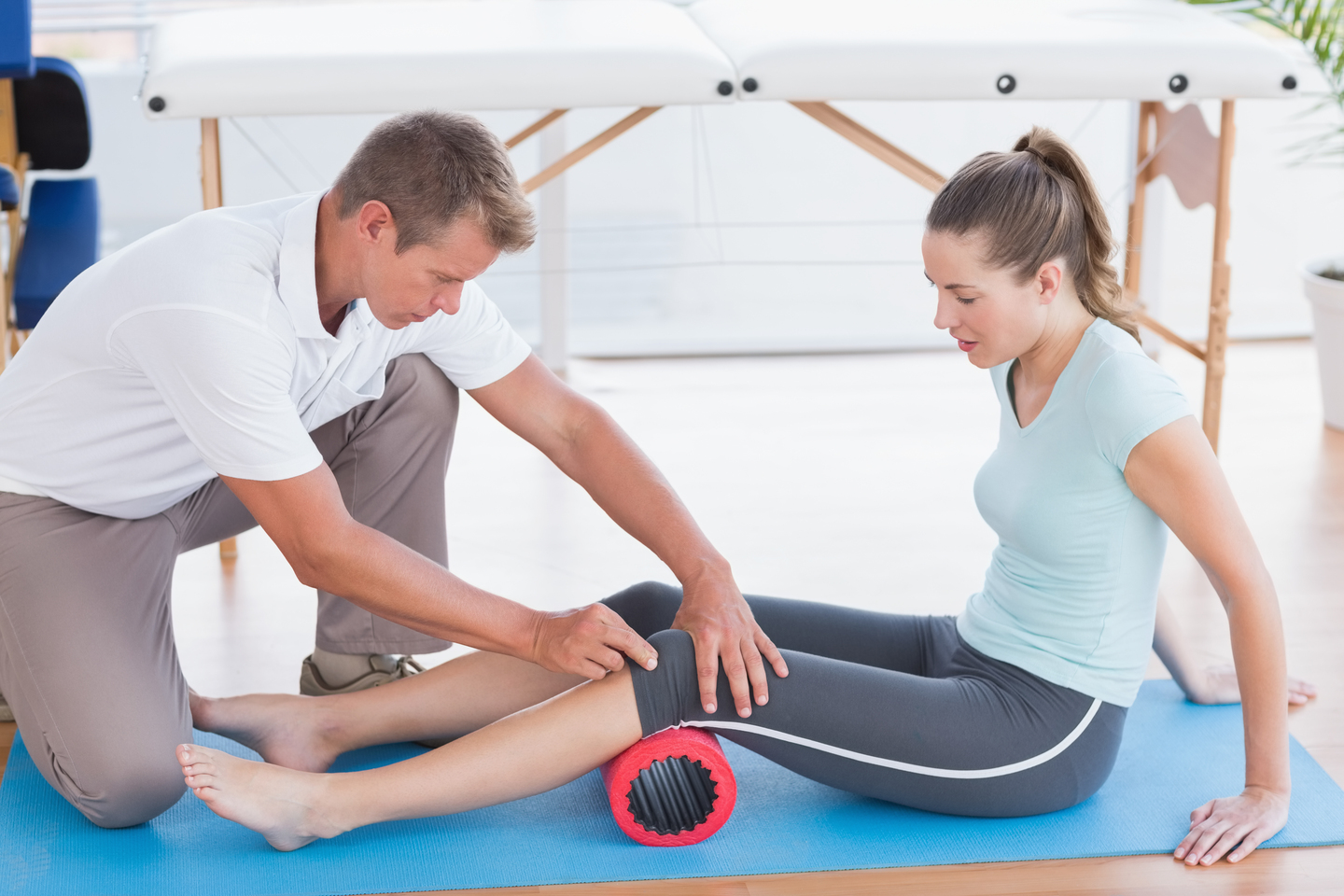 Trainer Working With Woman Exercise Mat at Core Concept